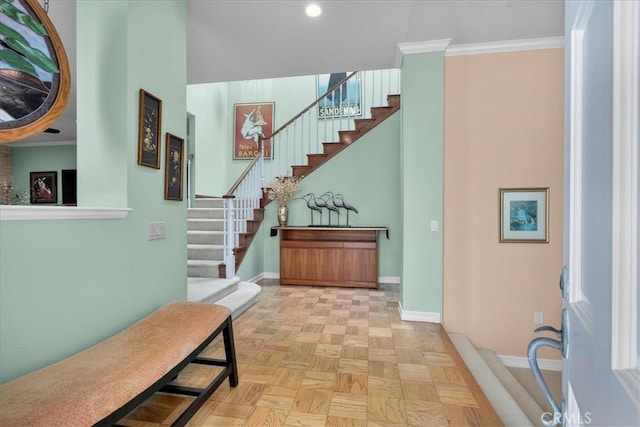 interior space with recessed lighting, baseboards, ornamental molding, and stairs