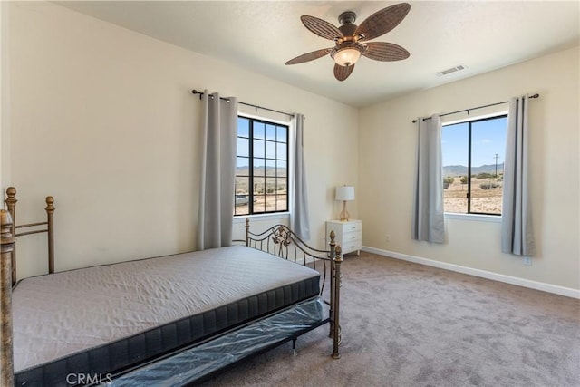 9170 Japatul Rd, Apple Valley, CA 92308 - carpeted bedroom with baseboards, a ceiling fan, and visible vents