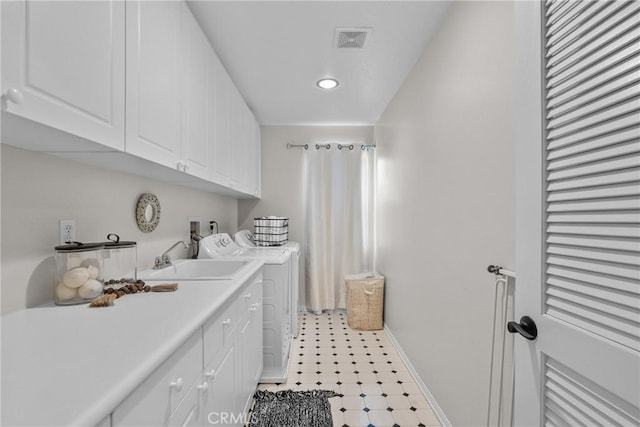 29081 Madrid Pl, Castaic, CA 91384 - laundry area with independent washer and dryer, cabinet space, baseboards, recessed lighting, and light floors