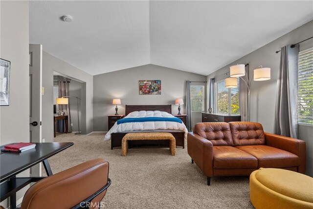 bedroom featuring carpet flooring and vaulted ceiling