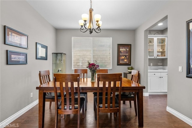 29081 Madrid Pl, Castaic, CA 91384 - dining space featuring a chandelier, baseboards, and dark wood-type flooring