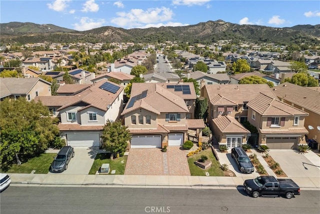 drone / aerial view featuring a mountain view and a residential view
