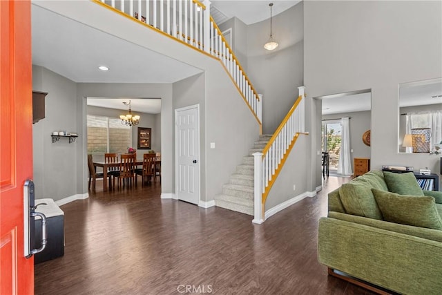 29081 Madrid Pl, Castaic, CA 91384 - entrance foyer with wood finished floors, stairway, baseboards, a chandelier, and a towering ceiling