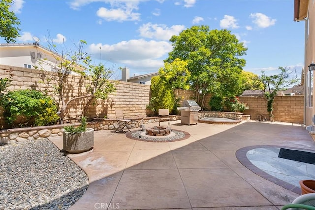 29081 Madrid Pl, Castaic, CA 91384 - fenced backyard featuring a fire pit, a patio area, and a grill
