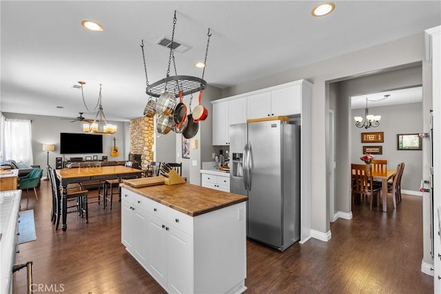 29081 Madrid Pl, Castaic, CA 91384 - kitchen featuring stainless steel refrigerator with ice dispenser, wooden counters, a chandelier, a center island, and white cabinets