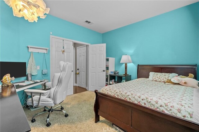 bedroom featuring a closet and visible vents