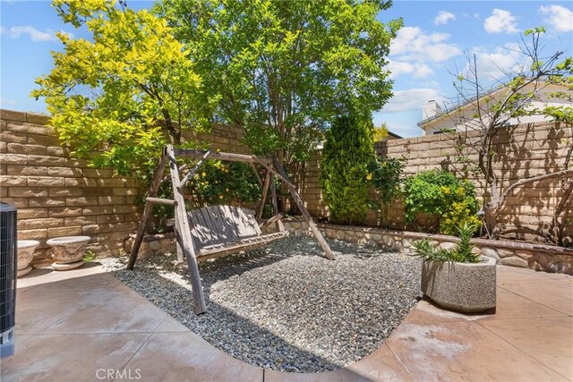 view of yard with a fenced backyard and a patio area