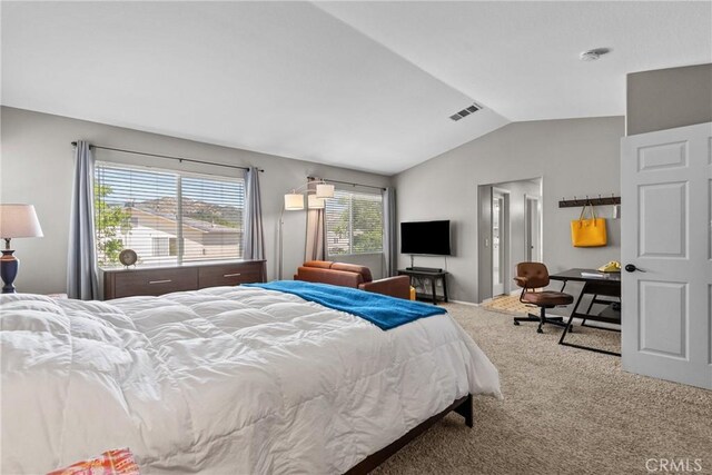 bedroom featuring visible vents, carpet, and lofted ceiling