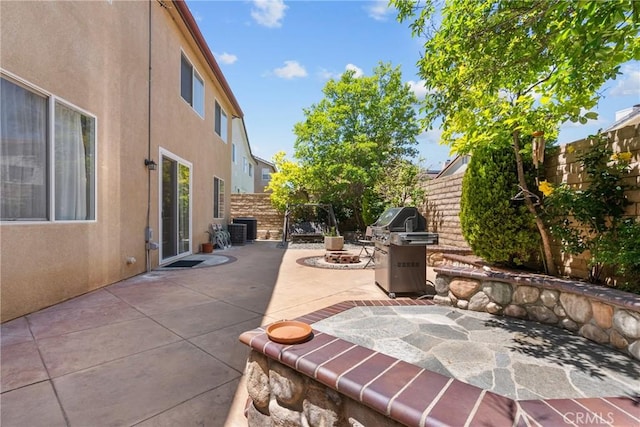 29081 Madrid Pl, Castaic, CA 91384 - fenced backyard featuring central AC unit, a patio area, and area for grilling