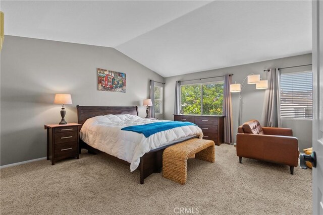 carpeted bedroom featuring vaulted ceiling