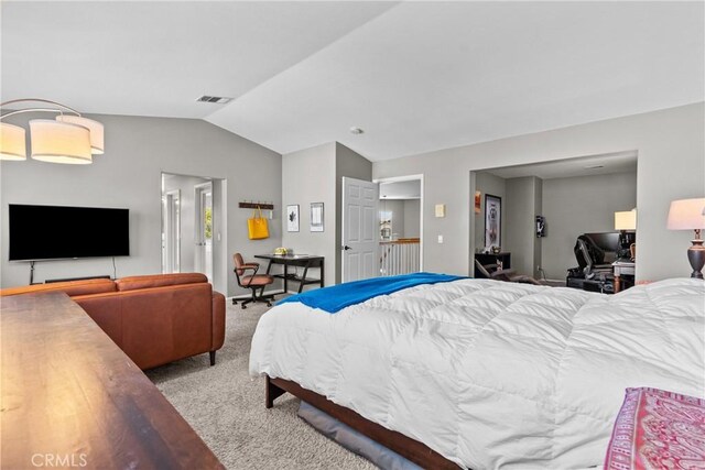 carpeted bedroom with vaulted ceiling and visible vents
