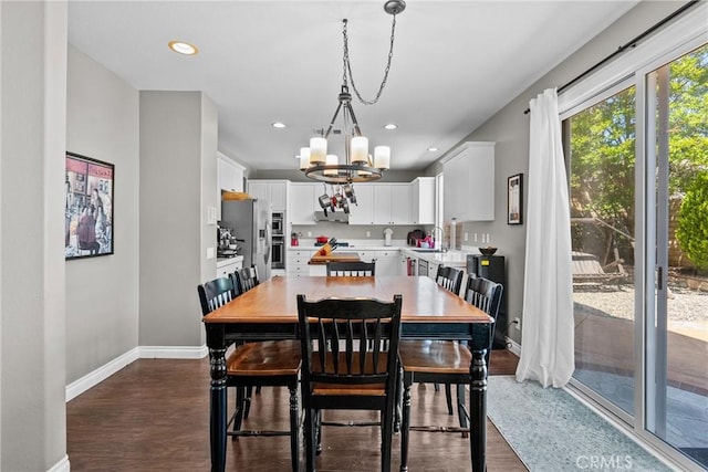 29081 Madrid Pl, Castaic, CA 91384 - dining space featuring baseboards, a chandelier, dark wood finished floors, and recessed lighting
