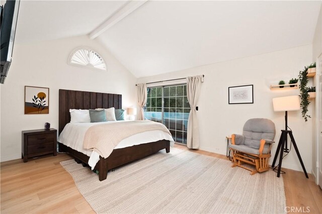 bedroom featuring baseboards, access to outside, lofted ceiling with beams, and light wood-type flooring