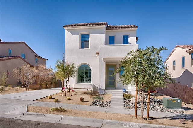 35719 Mccarthy St, Palm Desert, CA 92211 - mediterranean / spanish house featuring fence, stucco siding, and a tiled roof