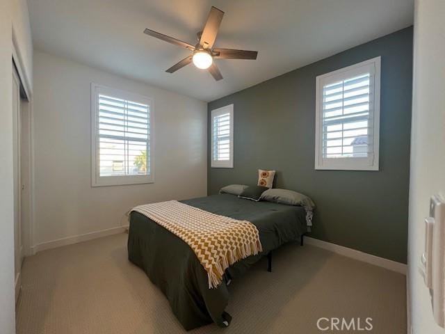 35719 Mccarthy St, Palm Desert, CA 92211 - bedroom featuring baseboards, light colored carpet, and ceiling fan