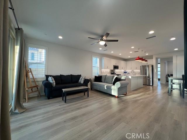 35719 Mccarthy St, Palm Desert, CA 92211 - living room with light wood-style floors, ceiling fan, recessed lighting, and visible vents