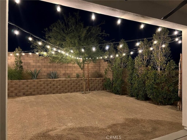 35719 Mccarthy St, Palm Desert, CA 92211 - yard at twilight featuring a patio and a fenced backyard
