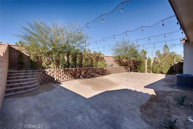 35719 Mccarthy St, Palm Desert, CA 92211 - view of yard with a fenced backyard, a patio area, and central AC unit