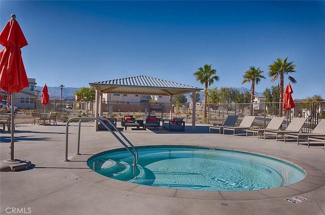 35719 Mccarthy St, Palm Desert, CA 92211 - view of swimming pool with a patio, a hot tub, and fence