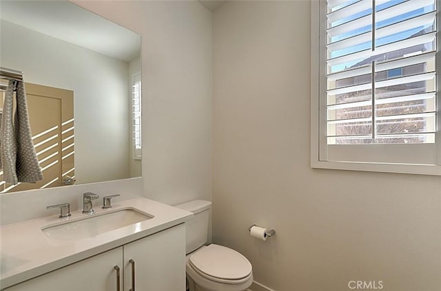 35719 Mccarthy St, Palm Desert, CA 92211 - half bathroom featuring vanity, a healthy amount of sunlight, and toilet