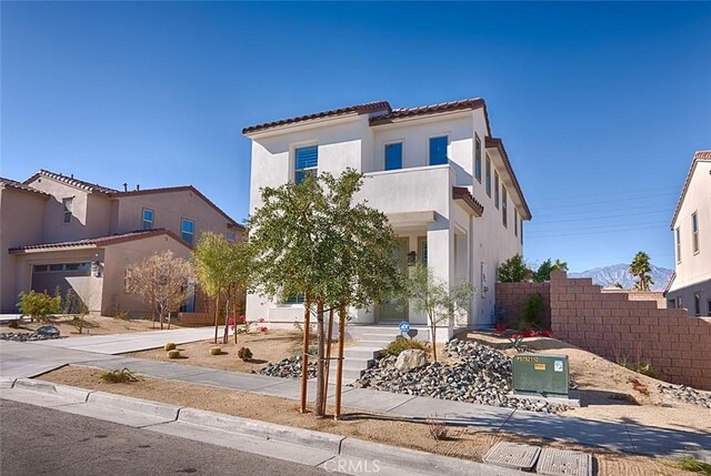 35719 Mccarthy St, Palm Desert, CA 92211 - mediterranean / spanish home with fence, a tiled roof, and stucco siding