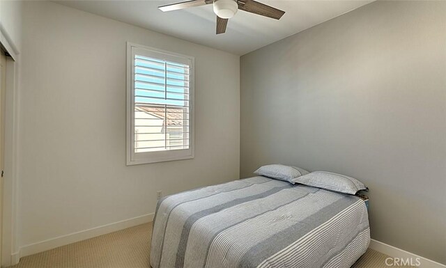 35719 Mccarthy St, Palm Desert, CA 92211 - carpeted bedroom featuring baseboards and a ceiling fan