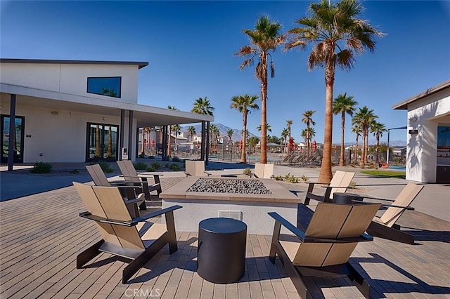 35719 Mccarthy St, Palm Desert, CA 92211 - view of patio featuring visible vents, french doors, and an outdoor fire pit