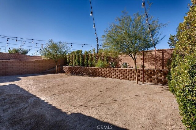 35719 Mccarthy St, Palm Desert, CA 92211 - view of yard featuring a fenced backyard