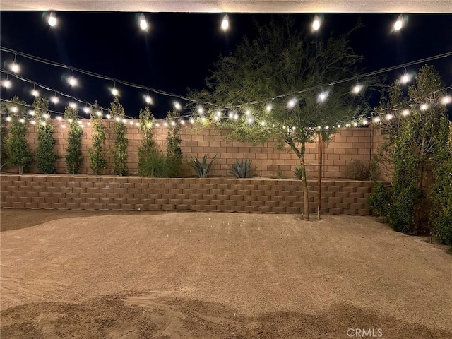 35719 Mccarthy St, Palm Desert, CA 92211 - yard at night featuring a fenced backyard