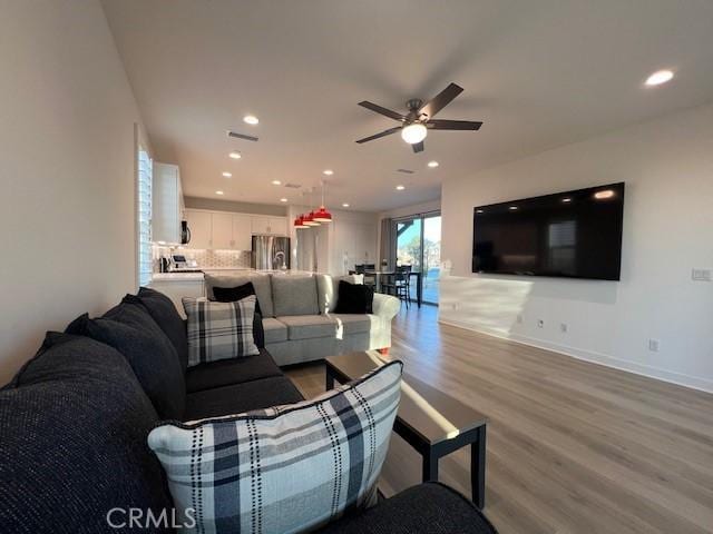 35719 Mccarthy St, Palm Desert, CA 92211 - living room with light wood-style floors, a ceiling fan, baseboards, recessed lighting, and visible vents