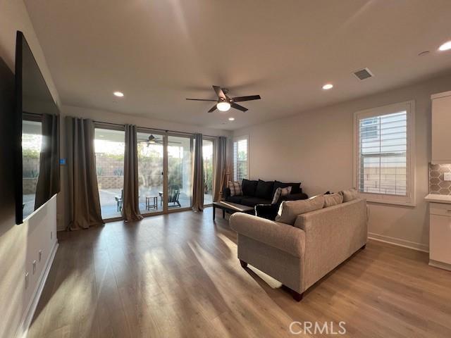 35719 Mccarthy St, Palm Desert, CA 92211 - living area with a ceiling fan, visible vents, baseboards, light wood finished floors, and recessed lighting