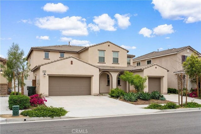 6506 Zion Way, Jurupa Valley, CA 92509 - mediterranean / spanish house with stucco siding, a tiled roof, driveway, and an attached garage