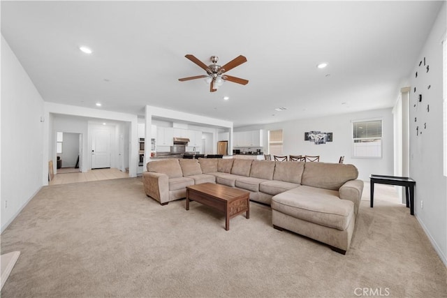 6506 Zion Way, Jurupa Valley, CA 92509 - living area featuring light colored carpet, recessed lighting, a ceiling fan, and baseboards