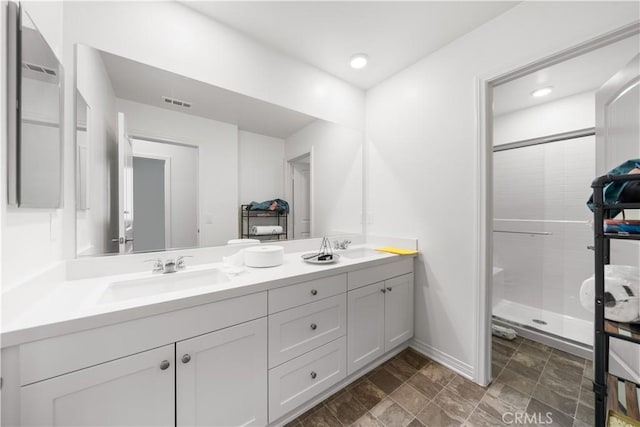 6506 Zion Way, Jurupa Valley, CA 92509 - bathroom featuring double vanity, a shower stall, baseboards, and recessed lighting