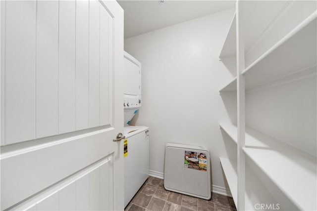 6506 Zion Way, Jurupa Valley, CA 92509 - laundry room with estacked washer and dryer and baseboards