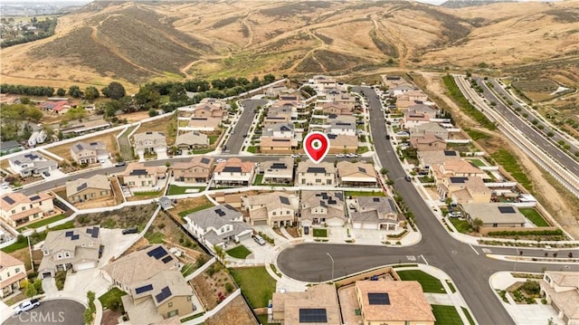 6506 Zion Way, Jurupa Valley, CA 92509 - aerial view of property and surrounding area featuring a mountainous background and nearby suburban area