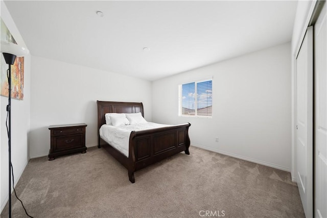 6506 Zion Way, Jurupa Valley, CA 92509 - bedroom with light colored carpet, a closet, and baseboards