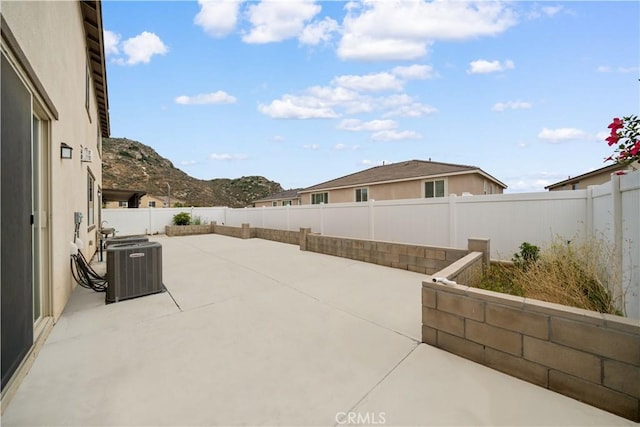 6506 Zion Way, Jurupa Valley, CA 92509 - view of patio featuring a fenced backyard and central AC