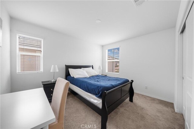 6506 Zion Way, Jurupa Valley, CA 92509 - carpeted bedroom with baseboards and a closet