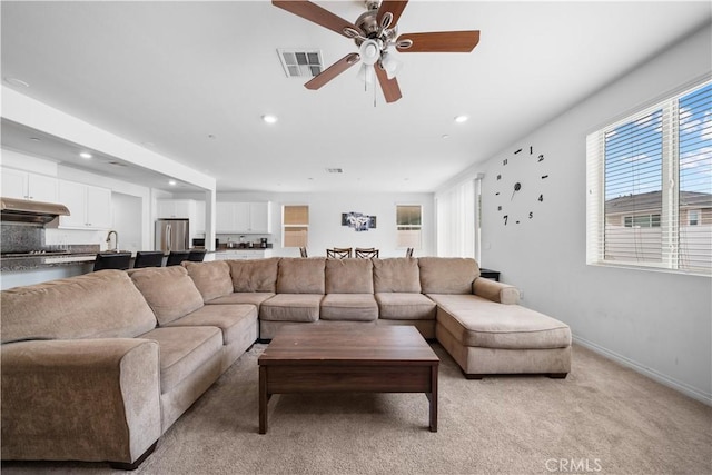6506 Zion Way, Jurupa Valley, CA 92509 - living area featuring recessed lighting, light carpet, a ceiling fan, and baseboards