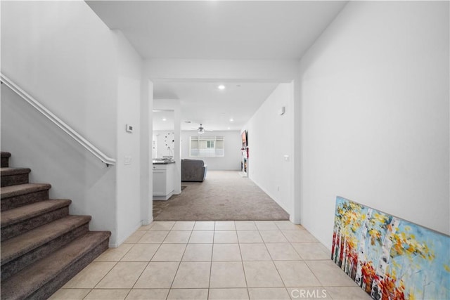 6506 Zion Way, Jurupa Valley, CA 92509 - hallway featuring light colored carpet, stairway, light tile patterned floors, recessed lighting, and baseboards