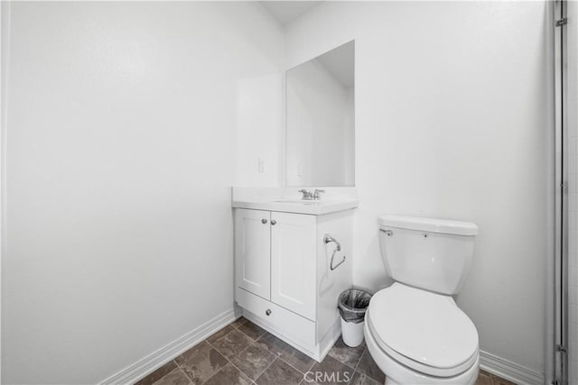 6506 Zion Way, Jurupa Valley, CA 92509 - bathroom with baseboards, toilet, and vanity