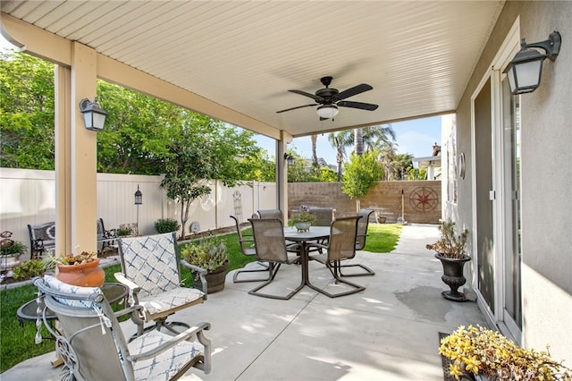 6347 Lyndsey St, Eastvale, CA 92880 - view of patio featuring a fenced backyard, outdoor dining area, and ceiling fan