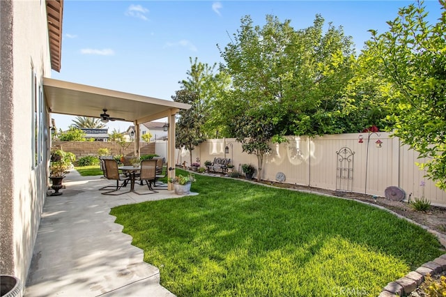 6347 Lyndsey St, Eastvale, CA 92880 - view of yard featuring a fenced backyard, a ceiling fan, and a patio area