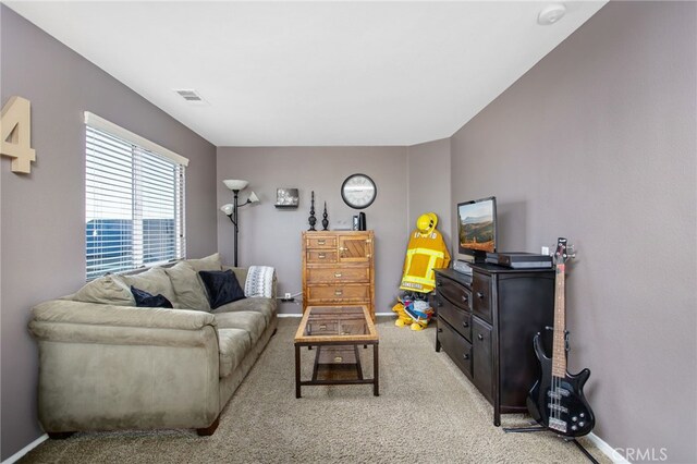 6347 Lyndsey St, Eastvale, CA 92880 - living area with visible vents, carpet, and baseboards