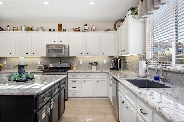 6347 Lyndsey St, Eastvale, CA 92880 - kitchen featuring a sink, white cabinets, and stainless steel appliances