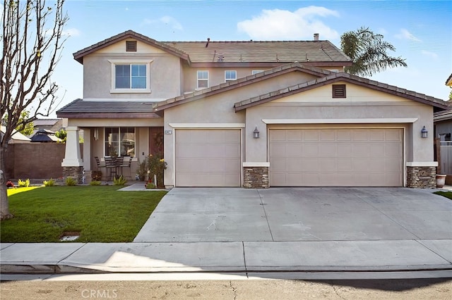 6347 Lyndsey St, Eastvale, CA 92880 - view of front facade featuring a garage, a front yard, stone siding, stucco siding, and concrete driveway