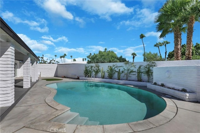 view of swimming pool featuring a fenced backyard and a fenced in pool