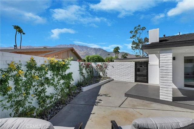 2480 N Aurora Dr, Palm Springs, CA 92262 - fenced backyard with a patio and a mountain view