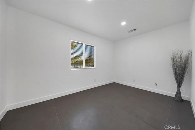 2480 N Aurora Dr, Palm Springs, CA 92262 - unfurnished room with recessed lighting and dark tile patterned floors